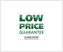 A green and white low price guarantee sign.