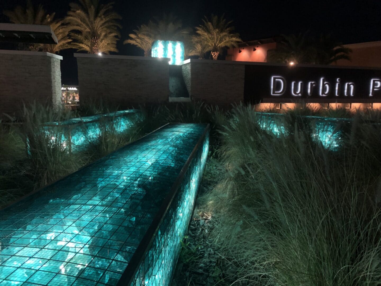 A night time photo of the entrance to durbin park.